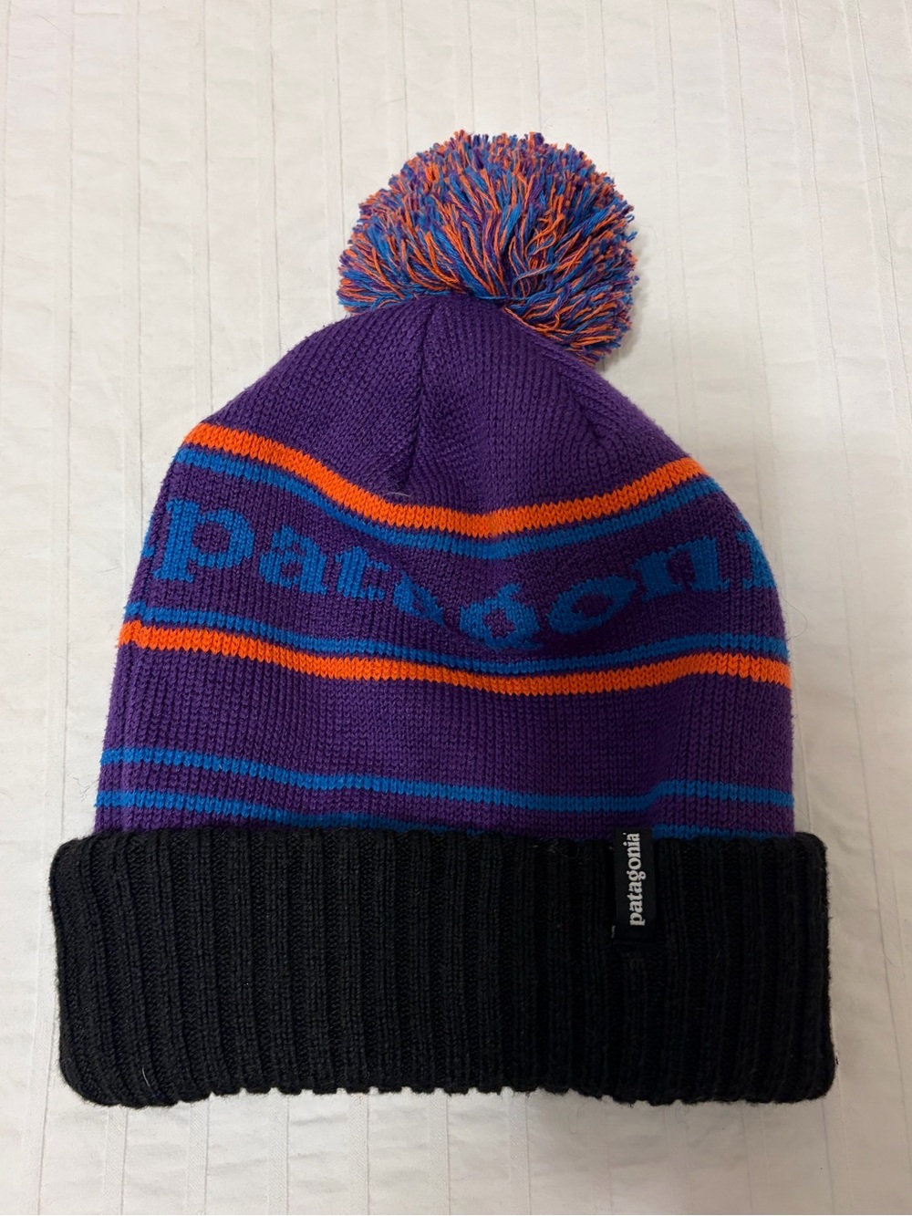 PATAGONIA- Powder Town Beanie in the "Park Stripe: Purple" colorway.